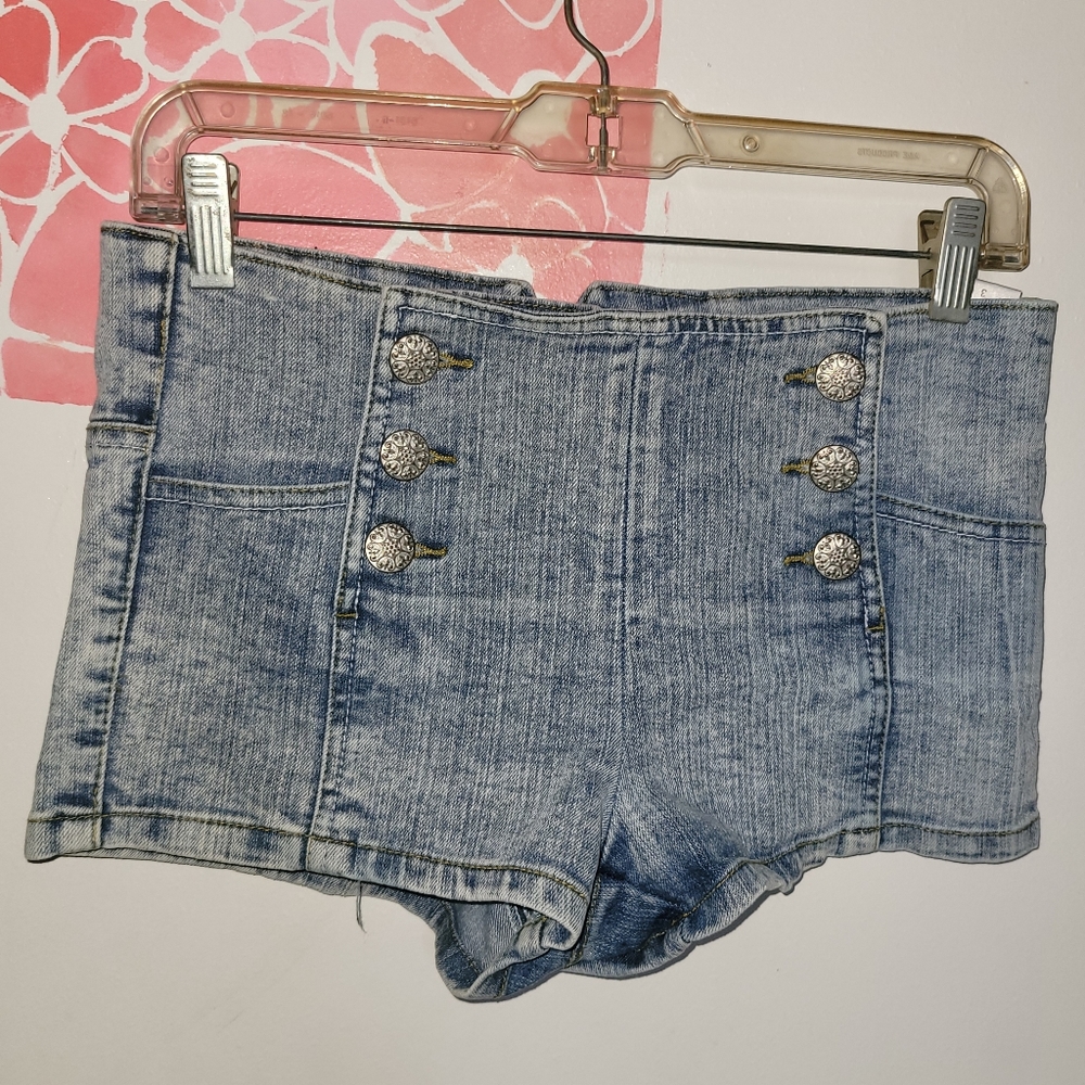 Light blue wash shorts with buttoned front design